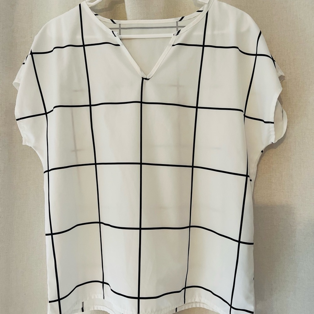 White and black checkered blouse